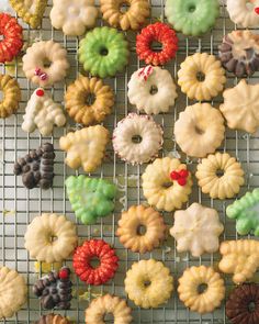 there are many different types of donuts on the cooling rack in front of each other