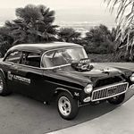 an old black and white photo of a classic car