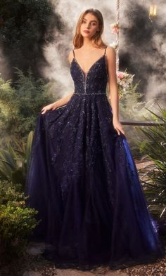 Navy blue v-neck a-line ball gown with open back. Blue Evening Dress With Corset Back For Gala, Evening V-neck Dress With Corset Back, Elegant V-neck Gown With Corset Back, Elegant Blue Ball Gown With Corset Back, V-neck Prom Ball Gown With Fitted Bodice, Elegant V-neck Gown For Homecoming, Blue V-neck Prom Gown, Formal V-neck Gown With Corset Back, Blue Evening Gown With Corset Back