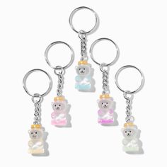 four key chains with teddy bears on them