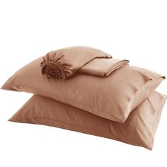 two brown pillows sitting on top of each other