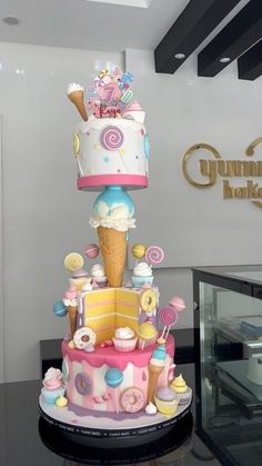 there is a large cake made to look like an ice cream cone on top of it