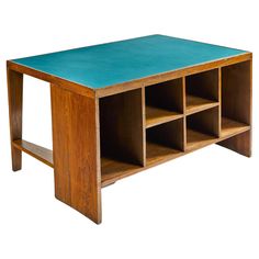 a wooden table with blue top and shelves