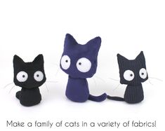 three small stuffed cats sitting next to each other with the caption make a family of cats in a variety of fabrics