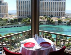 the table is set for two on the balcony