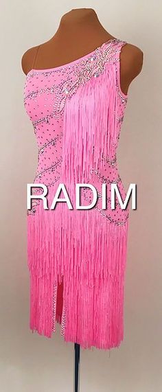 a pink dress with fringes on it and the words radm written in white