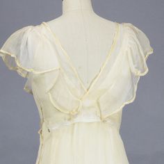 "Ethereal vintage 1930s floral embroidered sheer organdy dress featuring yellow and pale purplish gray silk embroidery. Styled with a silk trimmed gathered ruffled collar neckline with center pleating, plunging V'd cross-over back, nipped waist with bright yellow velvet centered organdy bow and bias cut skirt fitted through the hip where it flares out to the gathered hem. Three snap closures at left side of organdy dress. Comes complete with yellow under-slip. Label: None Content: Organdy, silk Organdy Dress, Outfits To Sew, Summer Wedding Party, Vintage 1930s Dress, 1930s Dress, Bias Cut Dress, Bias Cut Skirt, Cut Dress, Wedding Party Dress