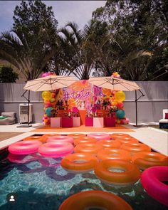 an outdoor pool decorated for a birthday party