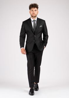 The Bryant Black Sharkskin Suit provides a standout appearance. Woven with a black sharkskin weave for a subtle shine, this custom made suit gives off powerful vibes. Feel sharp and distinguished in this premium outfit. Black Slim Fit Suit For Business Casual, Tailored Professional Suits For Black-tie Events, Modern Business Tuxedo With Suit Collar, Luxury Black Double Breasted Business Suit, Elegant Black Double Breasted Business Casual Suit, Black Tailored Sleek Suit, Sleek Tailored Black Suit, Luxury Black Tie Suits In Suiting Fabric, Sleek Fitted Black Suit