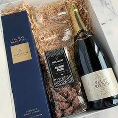 a bottle of wine and chocolates in a box