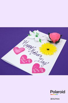 a card with flowers and hearts on it