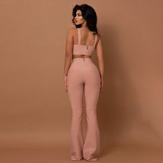 Two-Piece Bell Bottom Set Look your best with this two-piece bell bottom set! The bodycon fit flatters your curves, while the bustier top that zips up in the back provide a flirty touch. The stylish bell bottoms complete the look with a timeless appeal. Feel confident and empowered in this must-have set! Fitted Flare Party Sets, Fitted Cropped Two-piece Pants, Fitted Cropped Pants Two-piece Set, Bare Back Dress, Short Graduation Dresses, Orange Pink Color, Celebrity Party, Mini Prom Dresses, Prom Dresses With Pockets