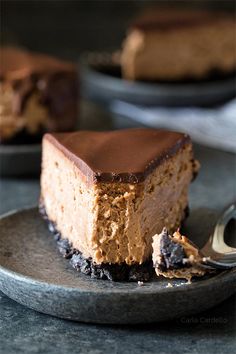 a piece of chocolate cheesecake on a plate with a fork