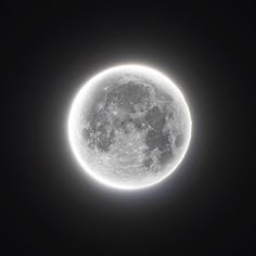 the full moon is visible in the dark sky