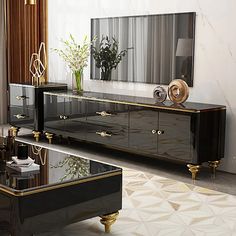 a black and gold sideboard in a living room with a large mirror on the wall