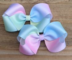 "~ Pastel Rainbow Boutique Hair Bow for Girls~ SIZE: Made with 1.5\" grosgrain ribbon, available in either a 4\" bow or 5\" bow NOTE: This listing is for ONE Hair Bow, extra pictures included to show the variations of the ribbon. NOTE: This ribbon is an ombre ribbon therefore the colors WILL vary from the picture in the listing. I have included several pictures, be sure to look at ALL the pictures to see the different variations of the ribbon. I can NOT guarantee the exact colors of this bow due Unicorn Hair Bow, Pastel Rainbow Hair, Birthday Hair Bow, Birthday Hair, Easter Hair Bow, Boutique Hair Bows, Unicorn Hair, Easter Girl, Pastel Hair