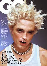 the cover of gq magazine features a man with blonde hair and piercings on his face