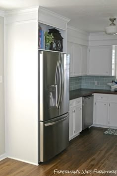 a refrigerator freezer sitting inside of a kitchen