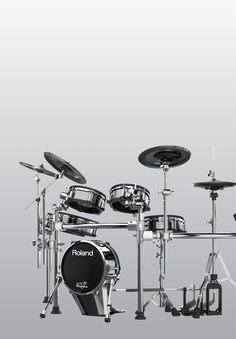 a black and white photo of a drum set