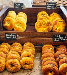 breads and pastries on display in a bakery