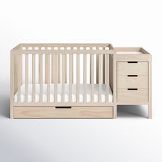 a baby crib with two drawers and a changing table next to it on a white background