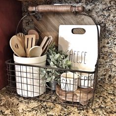 kitchen utensils in wire basket on counter top