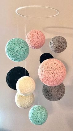 several balls of yarn hanging from the ceiling