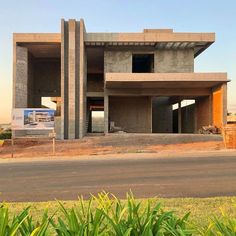 a large concrete building sitting on the side of a road