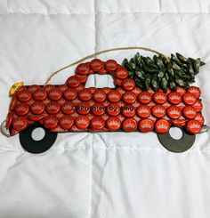 a red truck made out of beer bottle caps