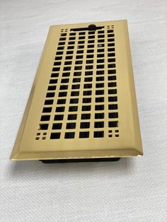 a metal grate sitting on top of a white table