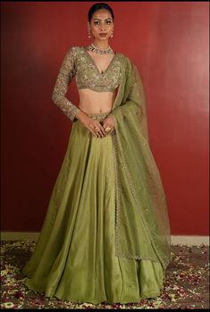 Made to Order/Measurement/Custom Order Lehenga - Color : olive green green - Fabric :  Silk - Fully flared paneled lehenga -   Pure Silk -   Attached  Dupatta with Blouse - Drawstring closure with Tassels - - It can be customize in any design or size  PLEASE NOTE: BUYERS ARE RESPONSIBLE FOR ANY CUSTOMS AND IMPORT TAXES THAT MAY APPLY. This is a made to order product. If you opt for 'Made To Measurement Option', we will provide a measurement template and you can share the measurements likewise. If you want to opt for 'Standard Size', Please refer to the size chart provided in the listing. Shipping: Standard Shipping is done by DHL ecommerce and it mostly takes 2 to 3 weeks to deliver after dispatch. Express Shipping is done by DHL express and it mostly delivers within a week after dispatch. Lehenga With Contrast Blouse, Silk Lengha, Mehendi Lehenga, Lehenga Green, Lengha Blouse, Formal Fits, Thesis Inspiration, Flared Lehenga, Blouse Lehenga