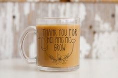 a coffee mug that says thank you for helping me grow