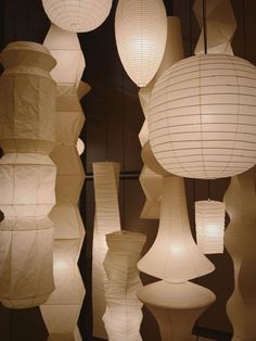 many white paper lanterns hanging from the ceiling