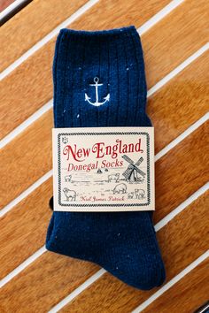 Put your coziest foot forward in our limited edition New England donegal socks. It's our spin of the yarn take on an Irish classic. We kept the signature feel and flecks you're used to in a donegal but added a distinctly New England touch with our seaside embroidery. Product Details: One size fits most Wash cold, lay flat to dry Imported Please note, we do not accept returns on our New England Donegal Socks. All purchases are final. Embroidery Product, Kiel James Patrick, Mobile Logo, Embroidered Socks, Monogram Outfit, Sweater Socks, Navy Anchor, James Patrick, Sunglasses Strap