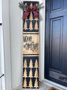 a wooden sign that says merry christmas on it