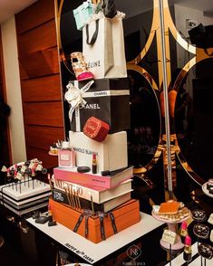 a table topped with lots of different types of cakes and pastries on top of each other