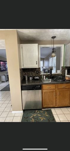 the kitchen is clean and ready to be used as a living room or dining area