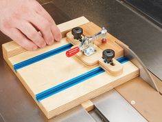 a person working on a woodworking project with a planer and two pieces of plywood