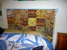 the headboard is made up to look like an old quilt