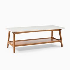 a white coffee table with wooden legs and a shelf underneath it on a white background