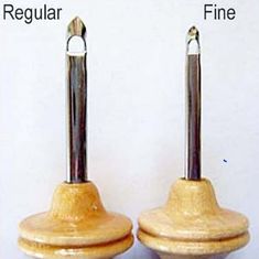 two wooden plugs with metal ends are shown