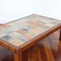 a wooden table sitting on top of a hard wood floor