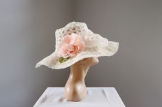 "Description and Measurements: Off white floppy sunhat with two big flowers on it. 5\" wide band, fits a 21-22\" head. Tag: No label Condition: Excellent Follow along on instagram @lovecharlesvintage" White Summer Hat For Kentucky Derby, Handmade Flower Hats For Summer, Vintage Cream Sun Hat For Summer, Vintage Sun Hat For Kentucky Derby Vacation, Summer Wedding Hats With Curved Brim, Summer Brimmed Hat For Weddings, Summer Brimmed Hat For Wedding, Summer Wide Brim Sun Hat For Wedding, Retro White Sun Hat For Spring