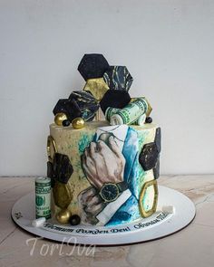 a cake decorated with an image of a hand holding money