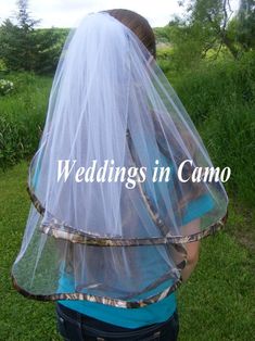 the back of a bride's veil with words wedding in camo on it