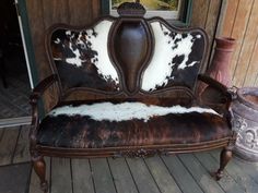 Handmade double chair featuring hair on hide.  This chair also has a press tooled look on the center front and entire back of the chair.  Decorative flowers hand carved top center and center of the seat.  Hide finished with brass tacks. Western Chair, Double Chair, Cowhide Furniture, Rustic Western Decor, Ranch Decor, Wall Art Personalized, Brass Tacks