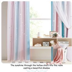 there is a bathroom with blue and pink curtains on the window sill, and a bathtub in front of it