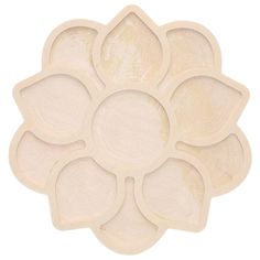 a wooden flower shaped tray with four petals on the bottom and one in the middle