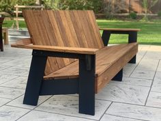 a wooden bench sitting on top of a patio