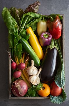 a box filled with lots of different types of vegetables